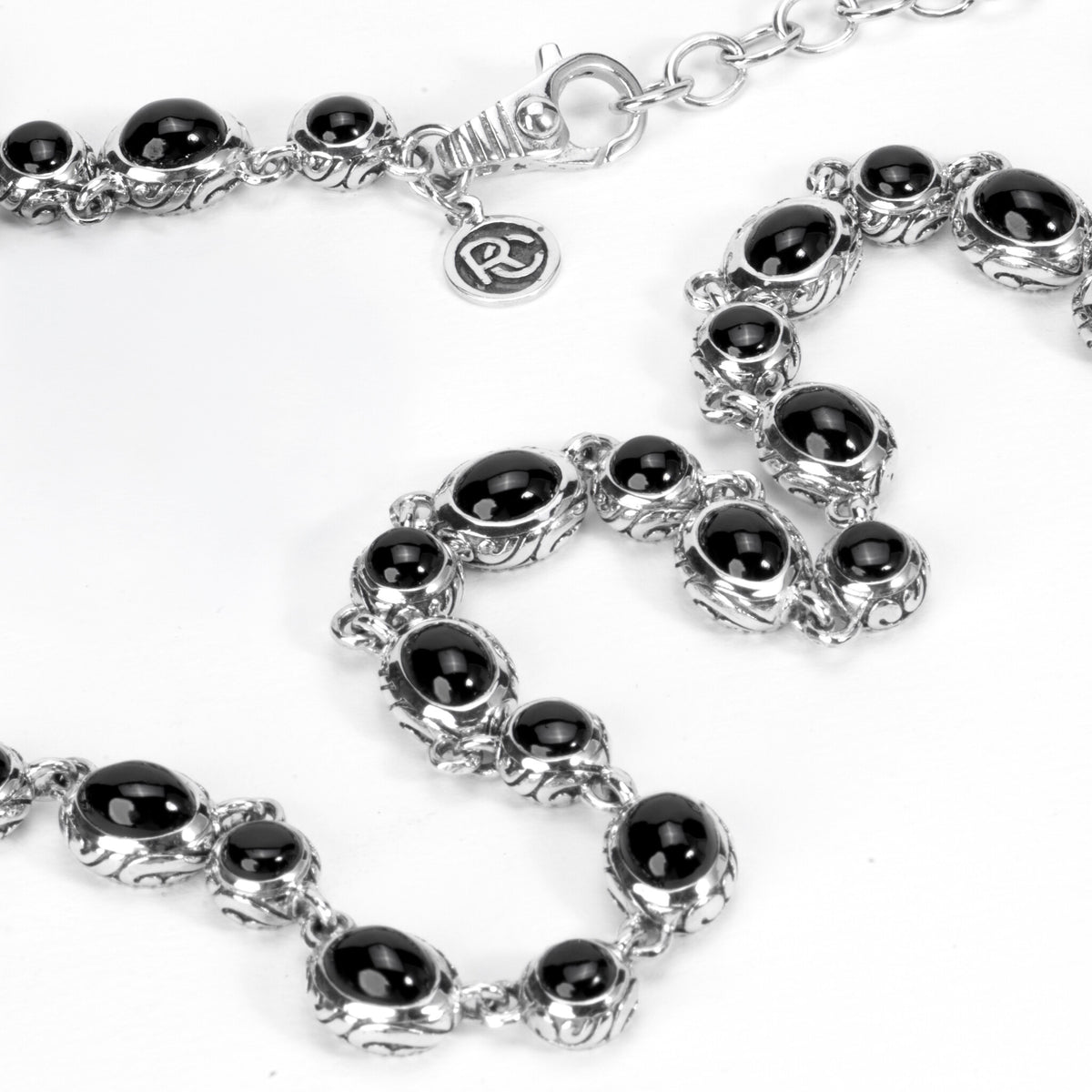 Kin Onyx Necklace, close view of the pattern hand carved on the side of each setting - Ryan Christian